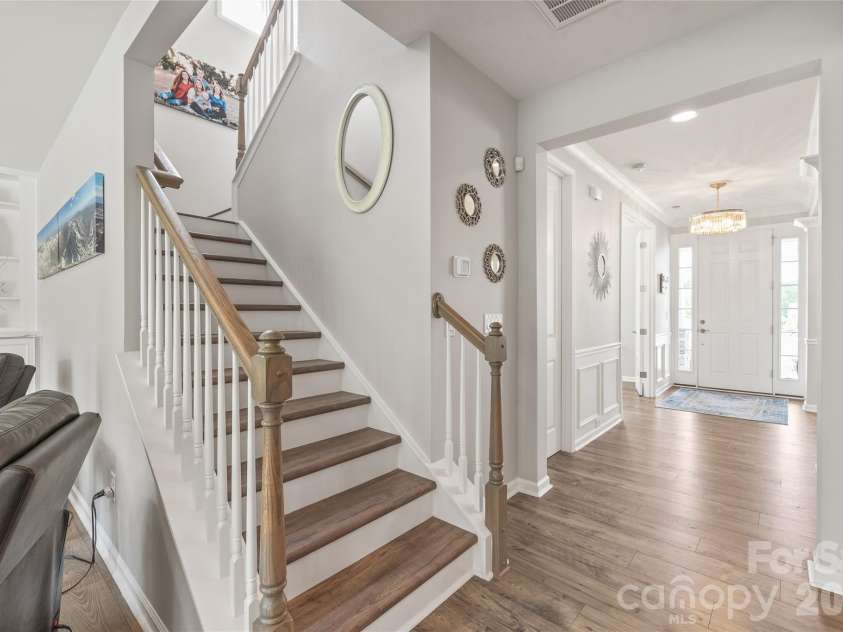 6440 Ancient Way, Fort Mill, SC 29707.  MLS# CAR4413430, YatesRealty ID 45254. Featuring continuous LVP flooring, the staircase leads to a spacious second level boasting four well-appointed bedrooms.