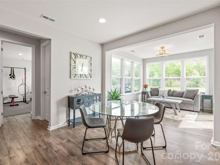 6440 Ancient Way, Fort Mill, SC 29707.  MLS# CAR4413430, YatesRealty ID 45254. Just off the breakfast area, you'll find a generously sized walk-in pantry alongside a main-level guest bedroom and full bath...a flexible space that easily serves as a home gym, guest suite, or dedicated hobby room.