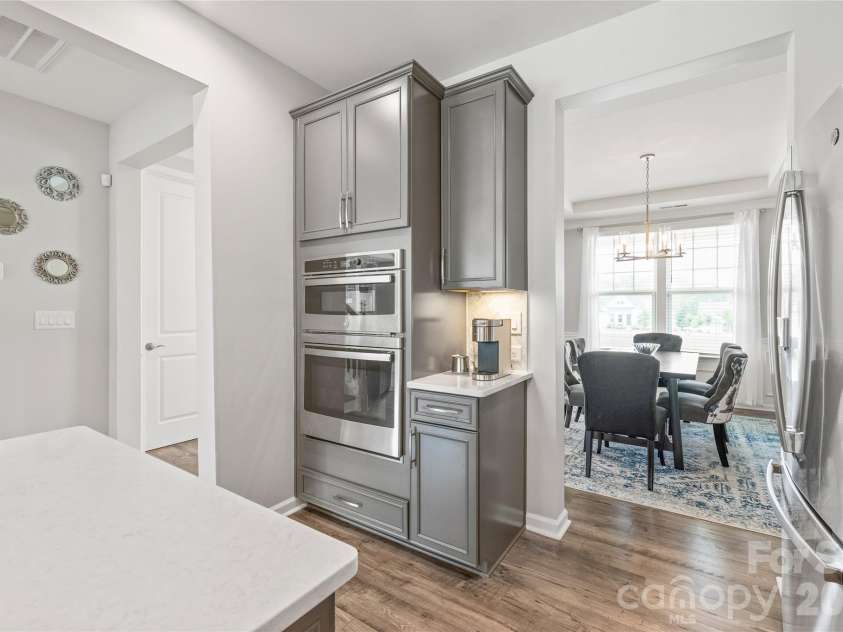 6440 Ancient Way, Fort Mill, SC 29707.  MLS# CAR4413430, YatesRealty ID 45254. Sleek built-in microwave and wall oven units deliver a streamlined, professional look while keeping counter space completely clear for prep.