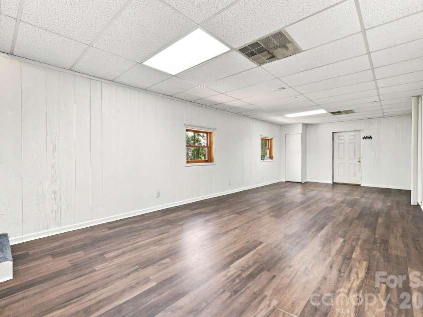 16 Westwood Drive, Candler, NC 28715.  MLS# CAR4413861, YatesRealty ID 45256. Lower Level flex room