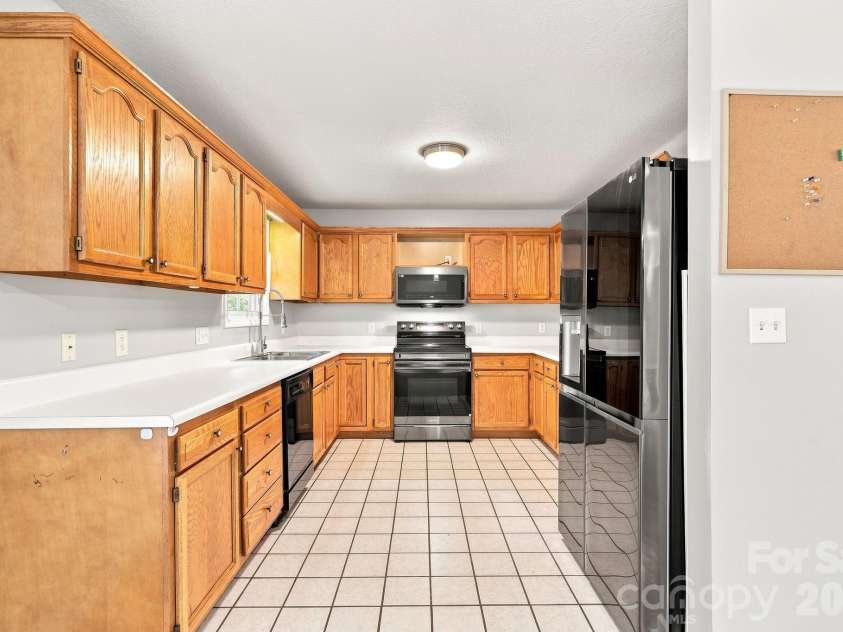 16 Westwood Drive, Candler, NC 28715.  MLS# CAR4413861, YatesRealty ID 45256. Tiled Kitchen