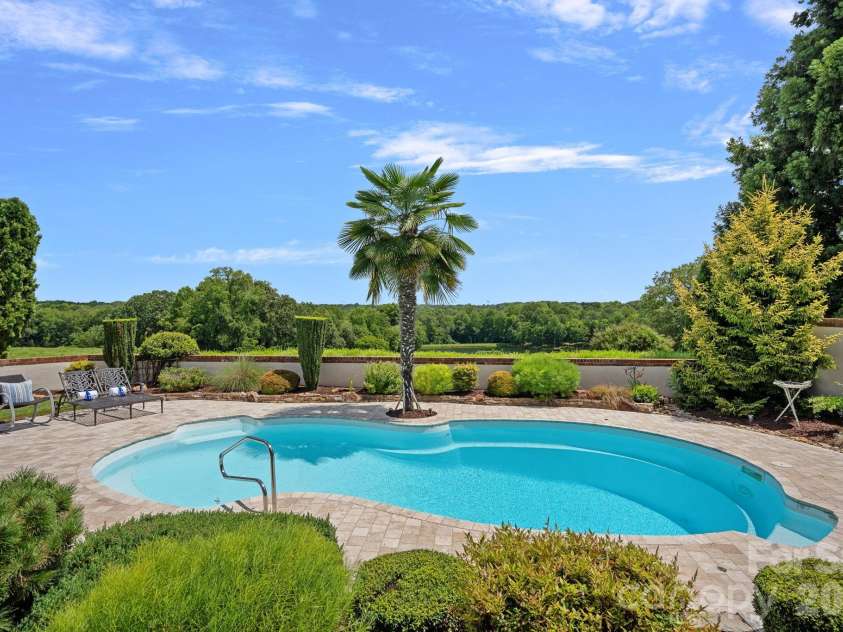 1807 Charden Road, Davidson, NC 28036.  MLS# CAR4410919, YatesRealty ID 45262. Beautiful saltwater pool heated with solar panels.