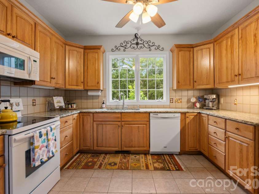 210 Clear Vista Circle, Asheville, NC 28805.  MLS# CAR4411634, YatesRealty ID 45263. Kitchen w/ views to the forest!