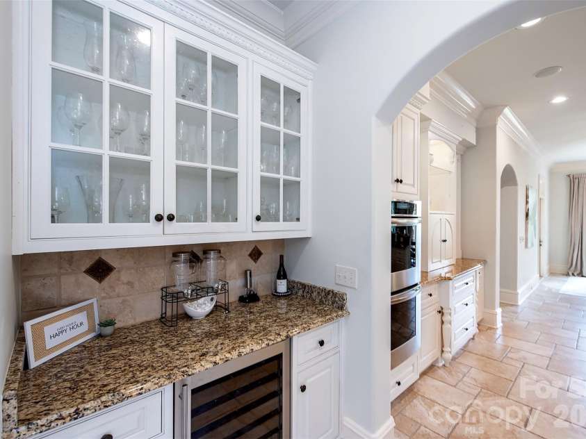 14905 Mcleary Circle, Charlotte, NC 28277.  MLS# CAR4410843, YatesRealty ID 45266. GE Monogram wine cooler located in kitchen wine bar.