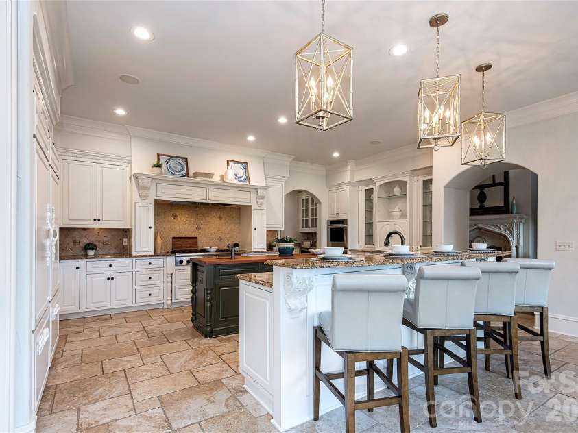 14905 Mcleary Circle, Charlotte, NC 28277.  MLS# CAR4410843, YatesRealty ID 45266. Kitchen has large pantry with built in shelves and custom cabinetry with all pull out drawers.