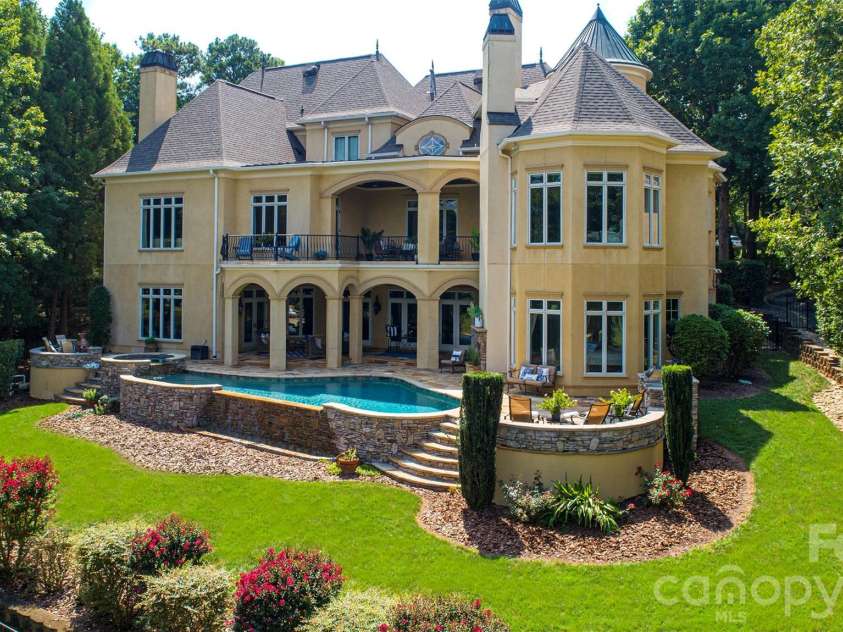 14905 Mcleary Circle, Charlotte, NC 28277.  MLS# CAR4410843, YatesRealty ID 45266. Stunning backyard views can be enjoyed from the upper veranda or the lower covered patio, which offers plenty of shade during the afternoon.