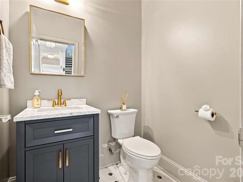7768 Burning Ridge Drive, Stanley, NC 28164.  MLS# CAR4411753, YatesRealty ID 45272. A Polished Powder Room