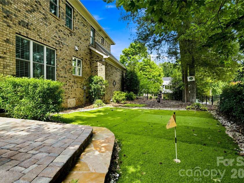7768 Burning Ridge Drive, Stanley, NC 28164.  MLS# CAR4411753, YatesRealty ID 45272. The Ultimate Backyard EscapeFrom Pizza Nights to Putting Greens