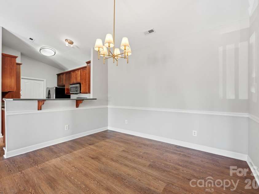 16648 Amberside Road, Cornelius, NC 28031.  MLS# CAR4414323, YatesRealty ID 45276. Counter hangover and space for bar stools