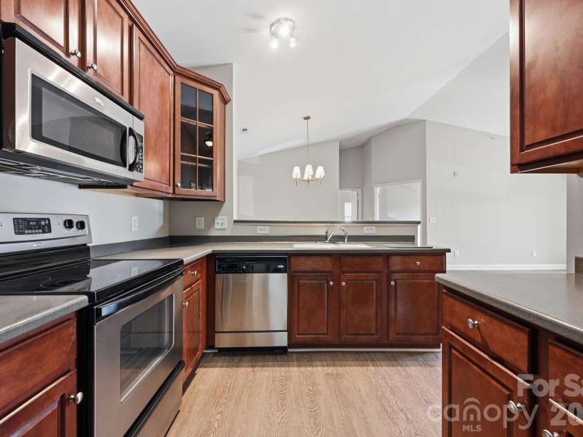 16648 Amberside Road, Cornelius, NC 28031.  MLS# CAR4414323, YatesRealty ID 45276. Dish washer and great pass through to dining area