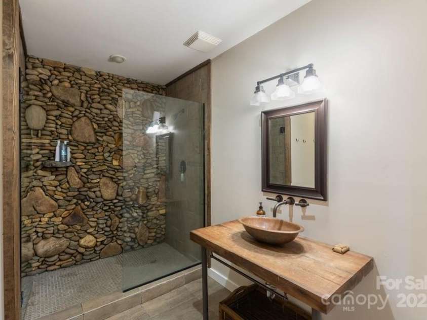 187 Big Buck Road, Highlands, NC 28741.  MLS# CAR4317414, YatesRealty ID 45286. Primary Bath on Lower Level