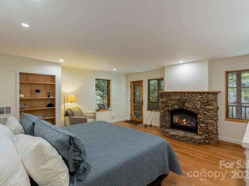 187 Big Buck Road, Highlands, NC 28741.  MLS# CAR4317414, YatesRealty ID 45286. Primary Ensuite Bedroom on the Lower Level with Screened Porch