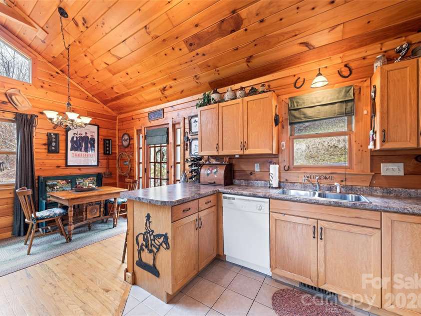 16 Hiawatha Drive, Maggie Valley, NC 28751.  MLS# CAR4405561, YatesRealty ID 45299. Kitchen and Ding Area