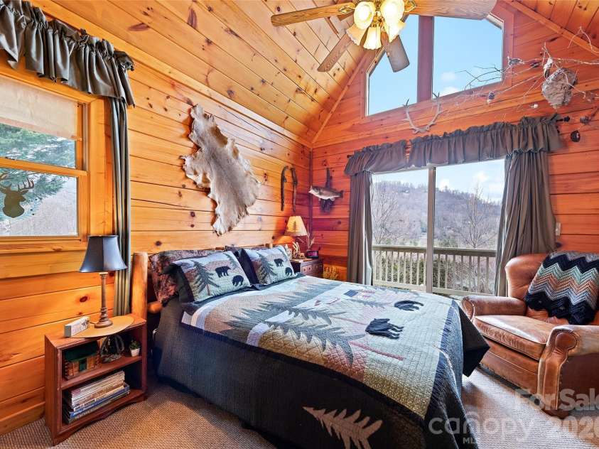 16 Hiawatha Drive, Maggie Valley, NC 28751.  MLS# CAR4405561, YatesRealty ID 45299. Main-Level Primary Bedroom with a View