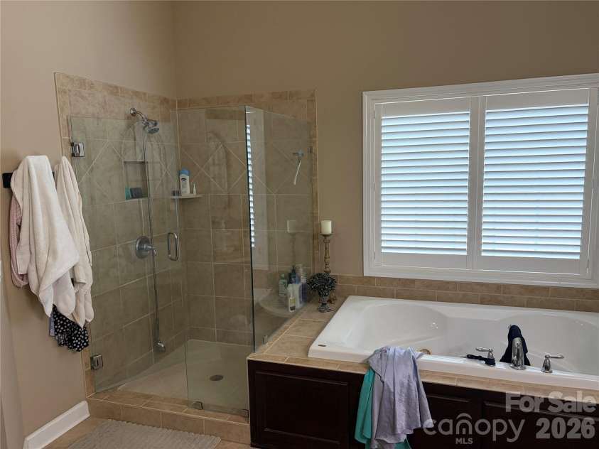 17228 Marbella Lane, Indian Land, SC 29707.  MLS# CAR4413011, YatesRealty ID 45302. Master Bath with seamless glass