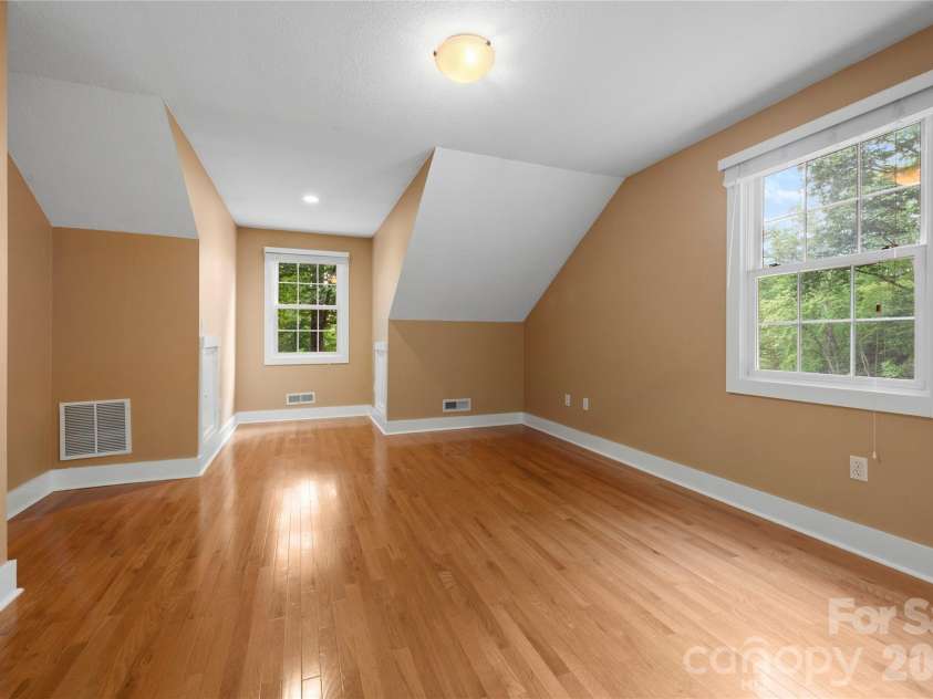 236 Holland Drive, Black Mountain, NC 28711.  MLS# CAR4412802, YatesRealty ID 45307. Bright, sun-filled second bedroom featuring a charming dormer window and spacious layout perfect for an office, hobby room or bedroom.