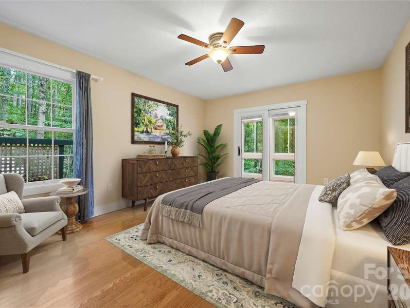 236 Holland Drive, Black Mountain, NC 28711.  MLS# CAR4412802, YatesRealty ID 45307. This master ensuite bedroom has been virtually staged to illustrate the potential for furnishing and layout.