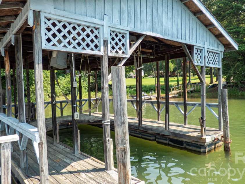 115 Rainbow Lane, Mooresville, NC 28117.  MLS# CAR4413654, YatesRealty ID 45316. Property's Private Covered Dock
