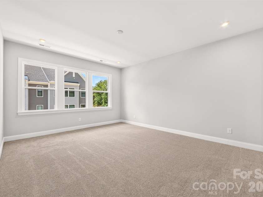6008 Yellow Buckeye Drive, Charlotte, NC 28277.  MLS# CAR4396142, YatesRealty ID 45319. Light filled primary bedroom