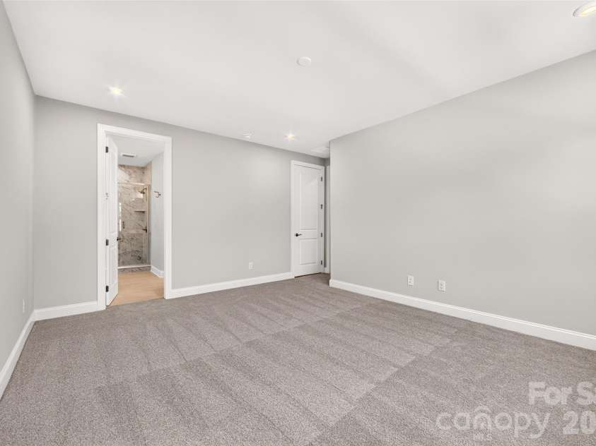 6008 Yellow Buckeye Drive, Charlotte, NC 28277.  MLS# CAR4396142, YatesRealty ID 45319. Light filled primary bedroom