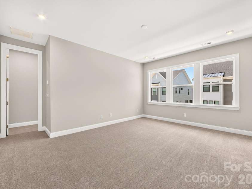 6008 Yellow Buckeye Drive, Charlotte, NC 28277.  MLS# CAR4396142, YatesRealty ID 45319. Light filled primary bedroom