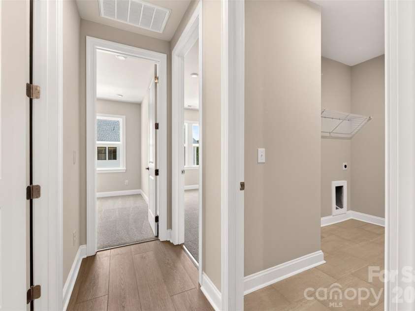 6008 Yellow Buckeye Drive, Charlotte, NC 28277.  MLS# CAR4396142, YatesRealty ID 45319. Third floor hallway with the laundry room