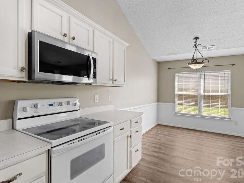 159 Bluffton Road, Mooresville, NC 28115.  MLS# CAR4408481, YatesRealty ID 45334. Stainless Microwave. Smooth Surface Range