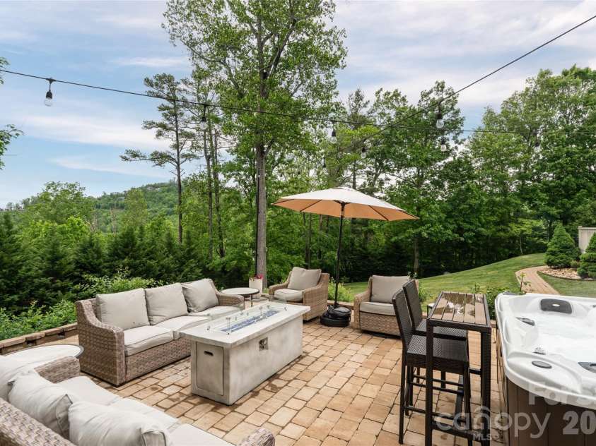 153 Mills Place, Asheville, NC 28804.  MLS# CAR4378268, YatesRealty ID 45336. Back patio