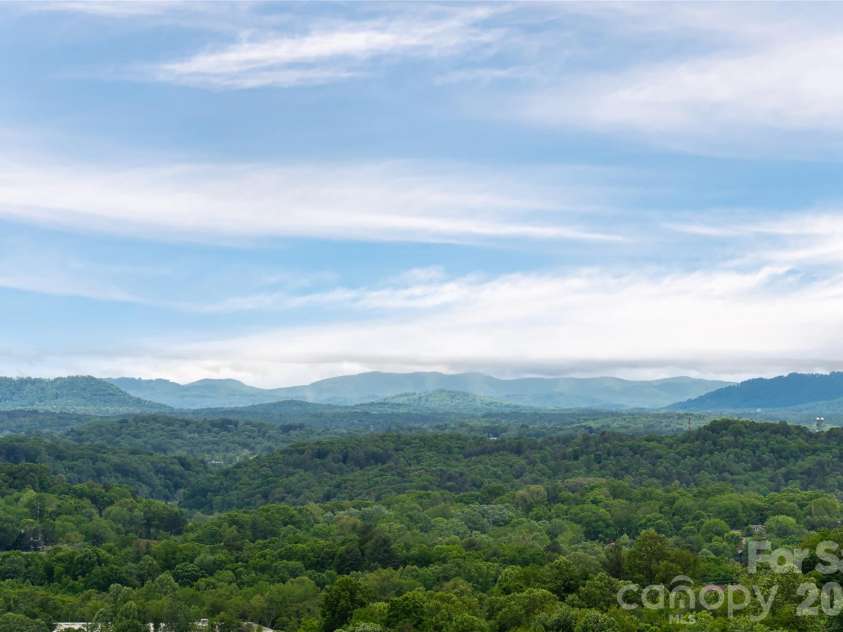 153 Mills Place, Asheville, NC 28804.  MLS# CAR4378268, YatesRealty ID 45336. Long range mountain views
