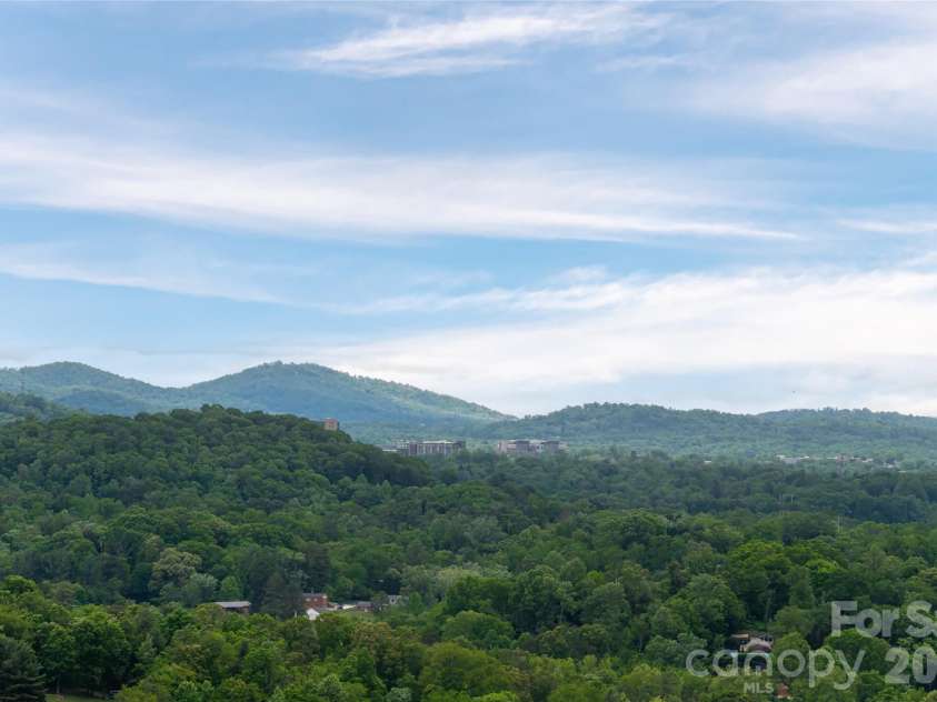 153 Mills Place, Asheville, NC 28804.  MLS# CAR4378268, YatesRealty ID 45336. Long range views