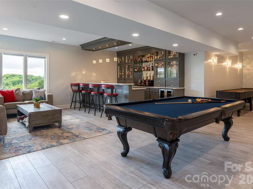 153 Mills Place, Asheville, NC 28804.  MLS# CAR4378268, YatesRealty ID 45336. Lower recreation room