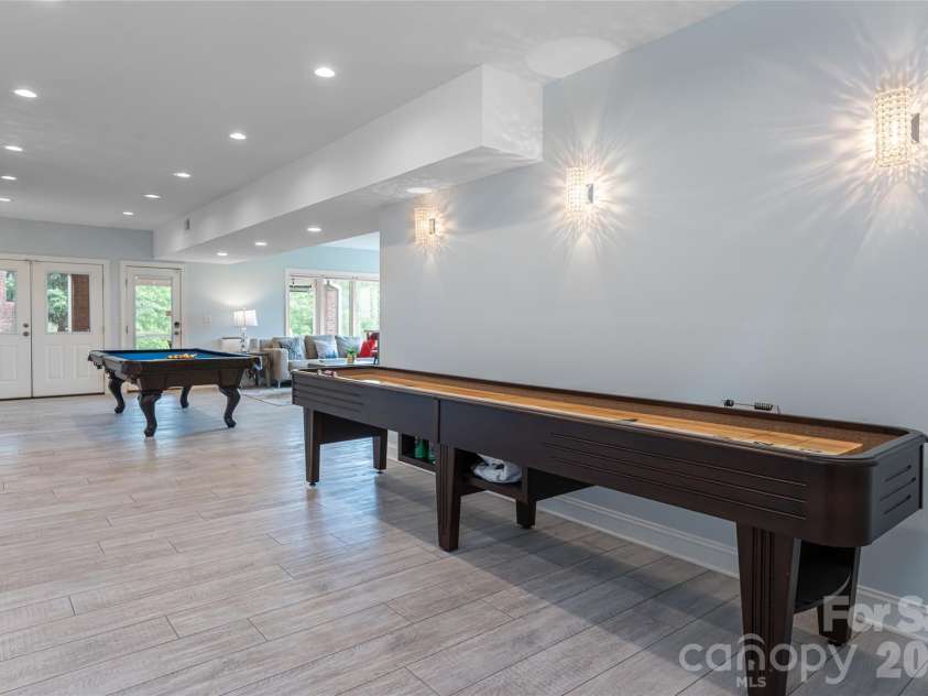 153 Mills Place, Asheville, NC 28804.  MLS# CAR4378268, YatesRealty ID 45336. Lower recreation room