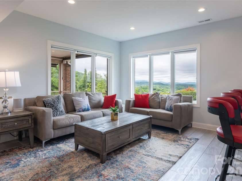 153 Mills Place, Asheville, NC 28804.  MLS# CAR4378268, YatesRealty ID 45336. Lower recreation room