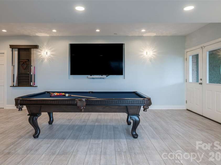 153 Mills Place, Asheville, NC 28804.  MLS# CAR4378268, YatesRealty ID 45336. Lower recreation room