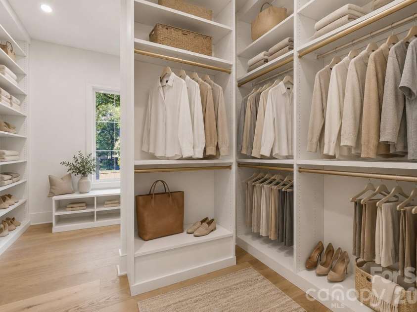 125 Randstone Court, Charlotte, NC 28211.  MLS# CAR4386565, YatesRealty ID 45343. Custom primary closet system with extensive built-in storage and space for optional stackable laundry.