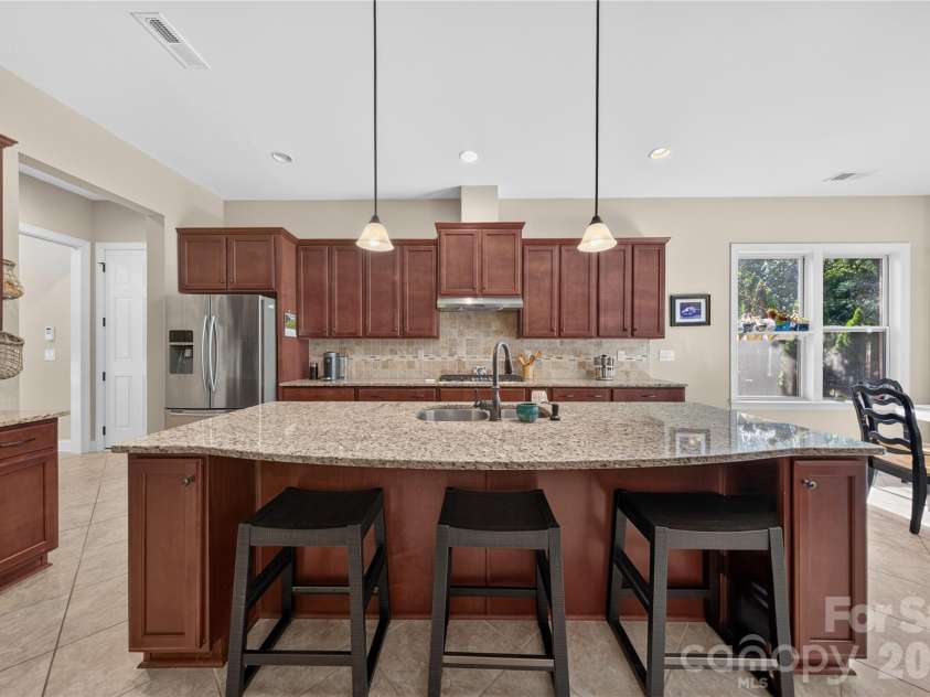 4028 Deer Track Court, Mint Hill, NC 28227.  MLS# CAR4397443, YatesRealty ID 45346. Island w/ Seating