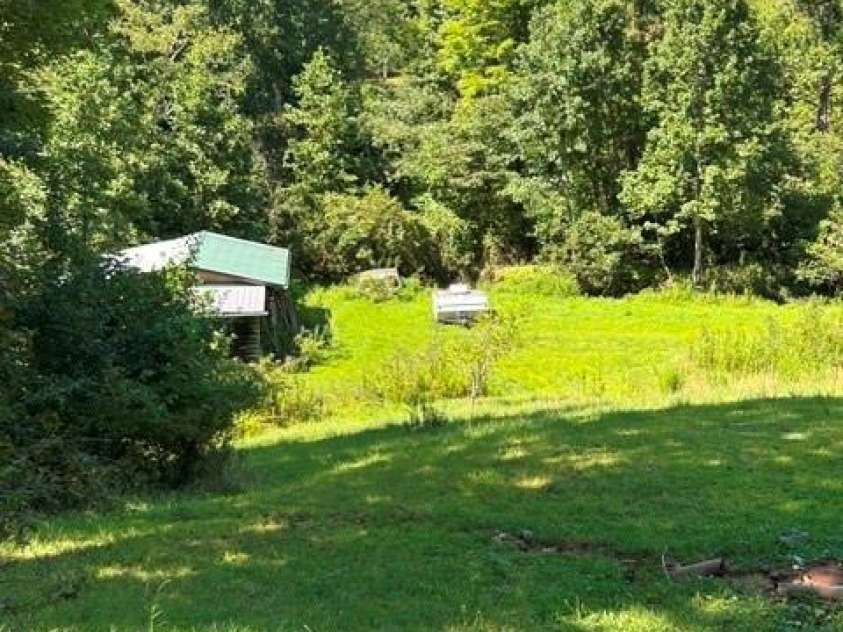 107 Flat Creek Drive, Lake Toxaway, NC 28747.  MLS# CAR4412174, YatesRealty ID 45349. Backyard