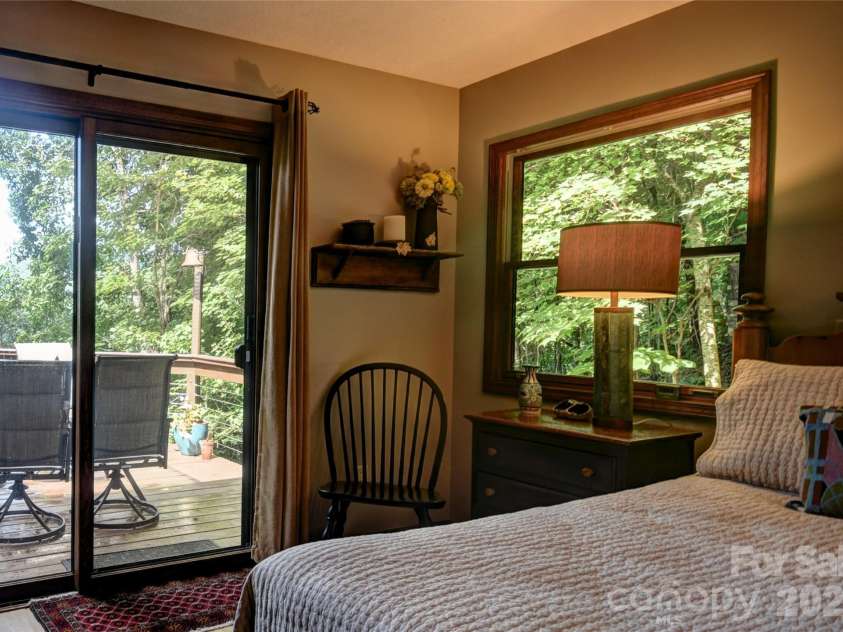 509 Deer Creek Trail, Maggie Valley, NC 28751.  MLS# CAR4408706, YatesRealty ID 45359. Access to the front deck from the primary bedroom