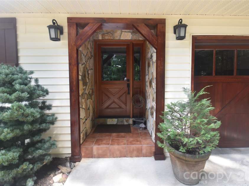 509 Deer Creek Trail, Maggie Valley, NC 28751.  MLS# CAR4408706, YatesRealty ID 45359. Beautiful front door with sidelite