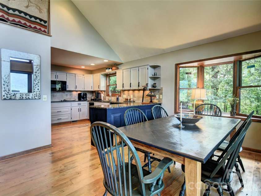 509 Deer Creek Trail, Maggie Valley, NC 28751.  MLS# CAR4408706, YatesRealty ID 45359. Dining area and gorgeous kitchen off the great room