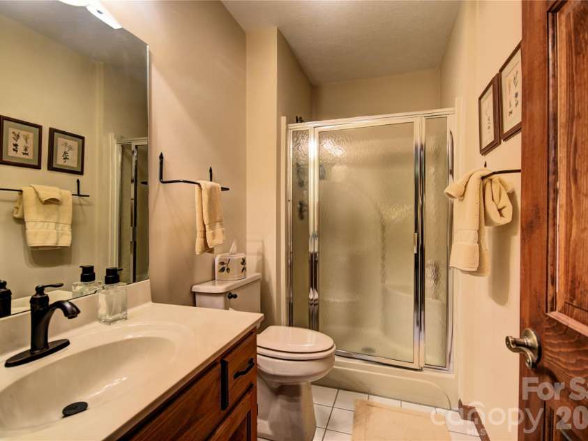 509 Deer Creek Trail, Maggie Valley, NC 28751.  MLS# CAR4408706, YatesRealty ID 45359. Downstairs bathroom