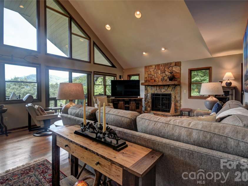 509 Deer Creek Trail, Maggie Valley, NC 28751.  MLS# CAR4408706, YatesRealty ID 45359. Electric shades on the large front wndows