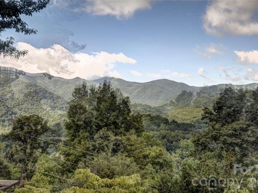 509 Deer Creek Trail, Maggie Valley, NC 28751.  MLS# CAR4408706, YatesRealty ID 45359. Huge views from the deck