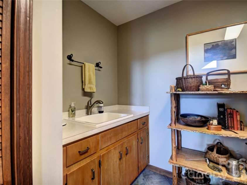 509 Deer Creek Trail, Maggie Valley, NC 28751.  MLS# CAR4408706, YatesRealty ID 45359. Sink in the laundry room