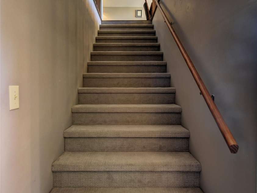 509 Deer Creek Trail, Maggie Valley, NC 28751.  MLS# CAR4408706, YatesRealty ID 45359. Stairs to the upper level