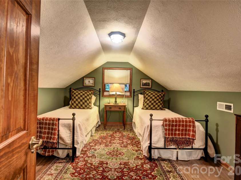 509 Deer Creek Trail, Maggie Valley, NC 28751.  MLS# CAR4408706, YatesRealty ID 45359. Upper-level bedroom