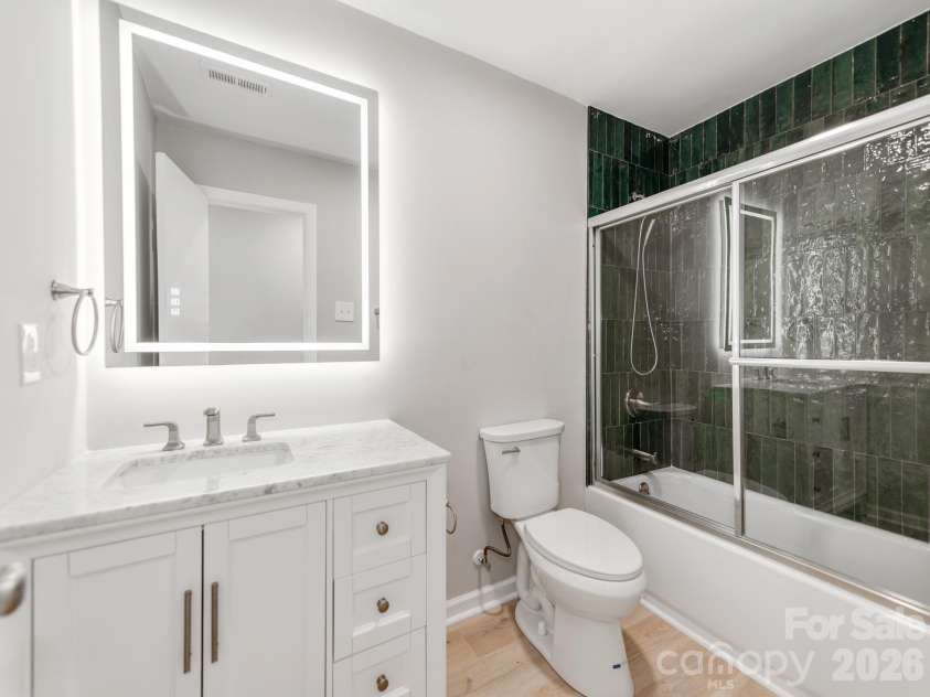 4925 Springview Road, Charlotte, NC 28213.  MLS# CAR4411619, YatesRealty ID 45366. High-End Bathroom with Custom Tile Showers