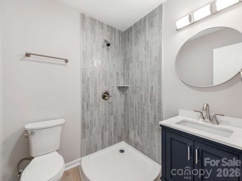 4925 Springview Road, Charlotte, NC 28213.  MLS# CAR4411619, YatesRealty ID 45366. High-End Bathroom with Custom Tile Showers
