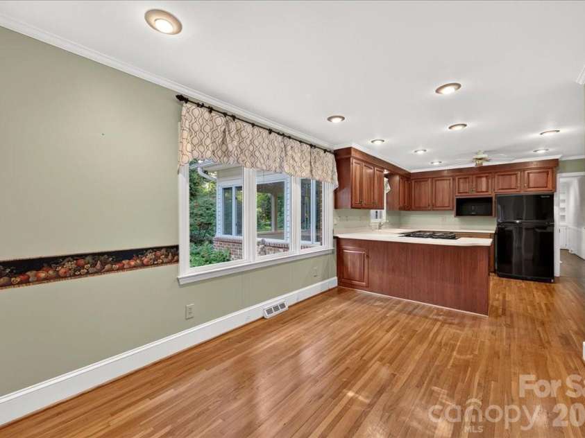 842 Ashmeade Road, Charlotte, NC 28211.  MLS# CAR4415245, YatesRealty ID 45375. Den & kitchen