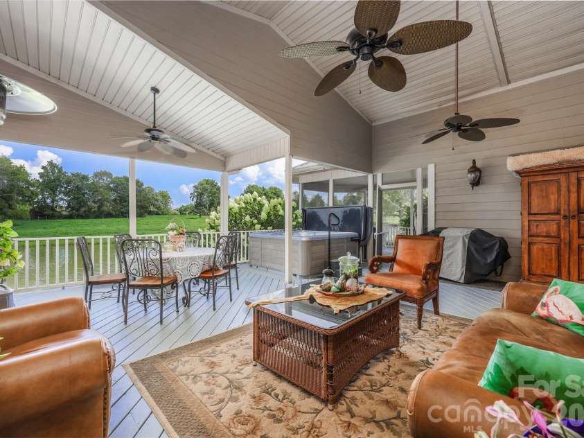 6851 Brantley Gordon Road, Denton, NC 27239.  MLS# CAR4409191, YatesRealty ID 45381. Covered back porch overlooking pond